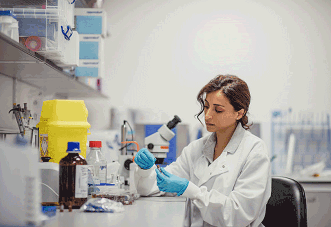 Lady drug testing in a lab